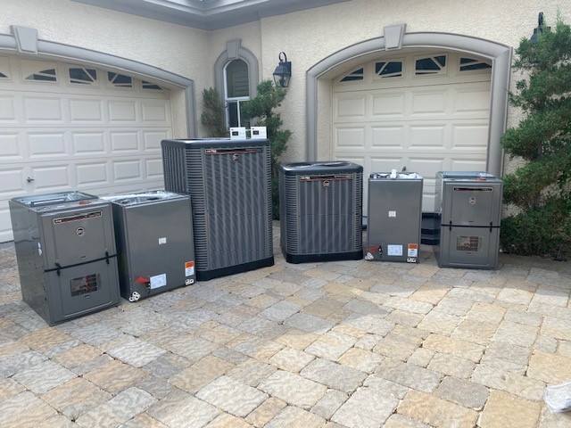 New AC units staged outside home for installation and replacement